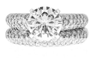 GORGEOUS PAVÉ DIAMONDS ADORN A FIERY MOISSANITE JEWEL IN OUR 